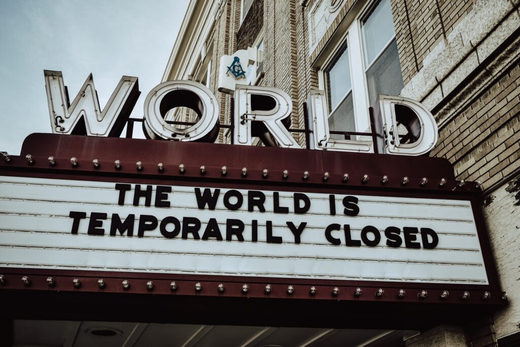 Sign outside cinema that says 'the world is temporarily closed' due to coronavirus